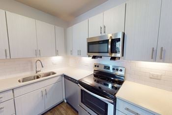 Over the range microwave with stainless steel appliances 